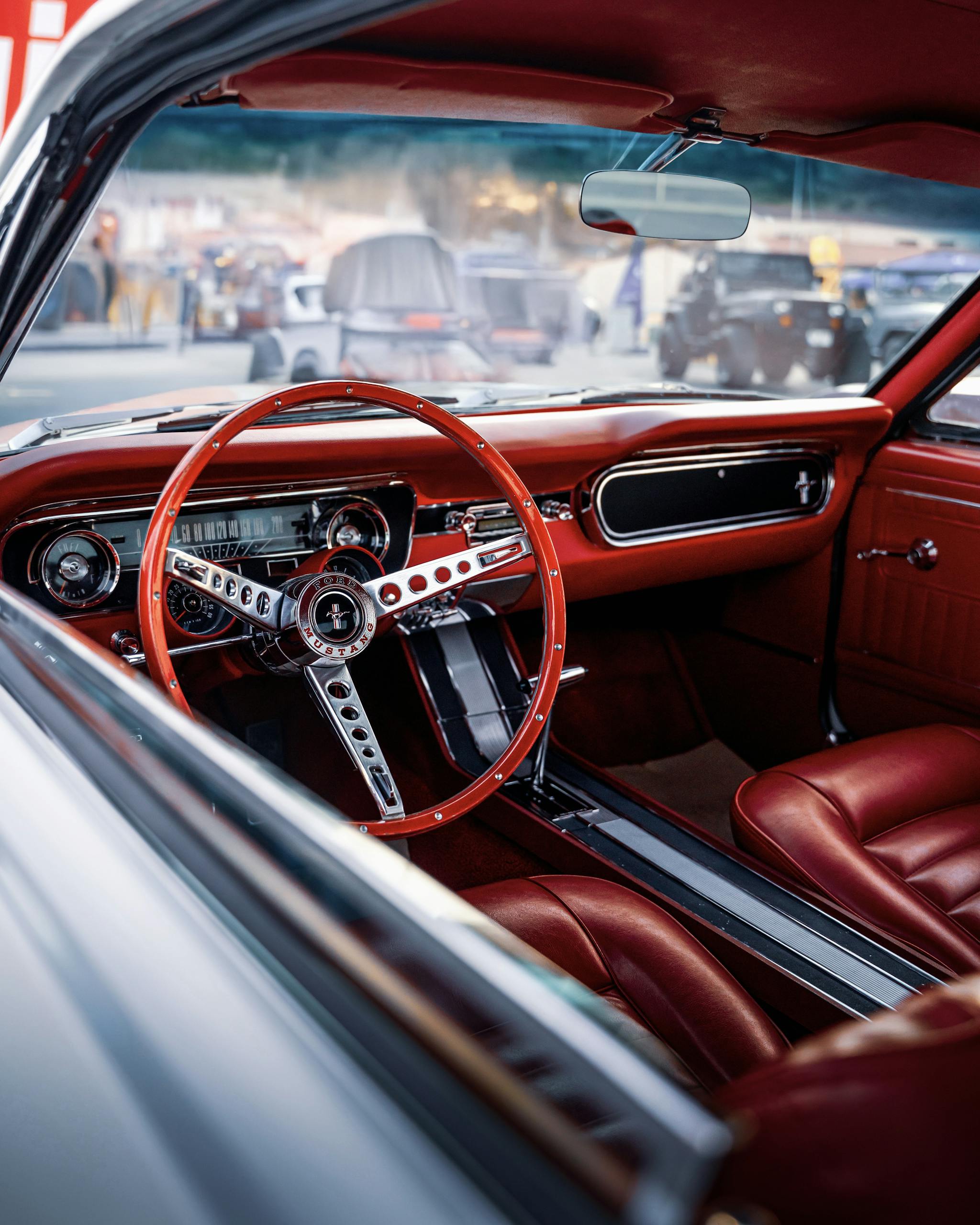 Beautiful vintage red interior of a classic car in İzmir, perfect showpiece for car enthusiasts.